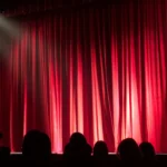 theatre-stage-pexels-monica-silvestre-713149-e1691369090863