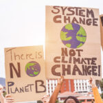 group-of-demonstrators-on-road-young-people-from-different-culture-and-race-fight-for-climate-change-global-warming-and-enviroment-concept-focus-on-banners
