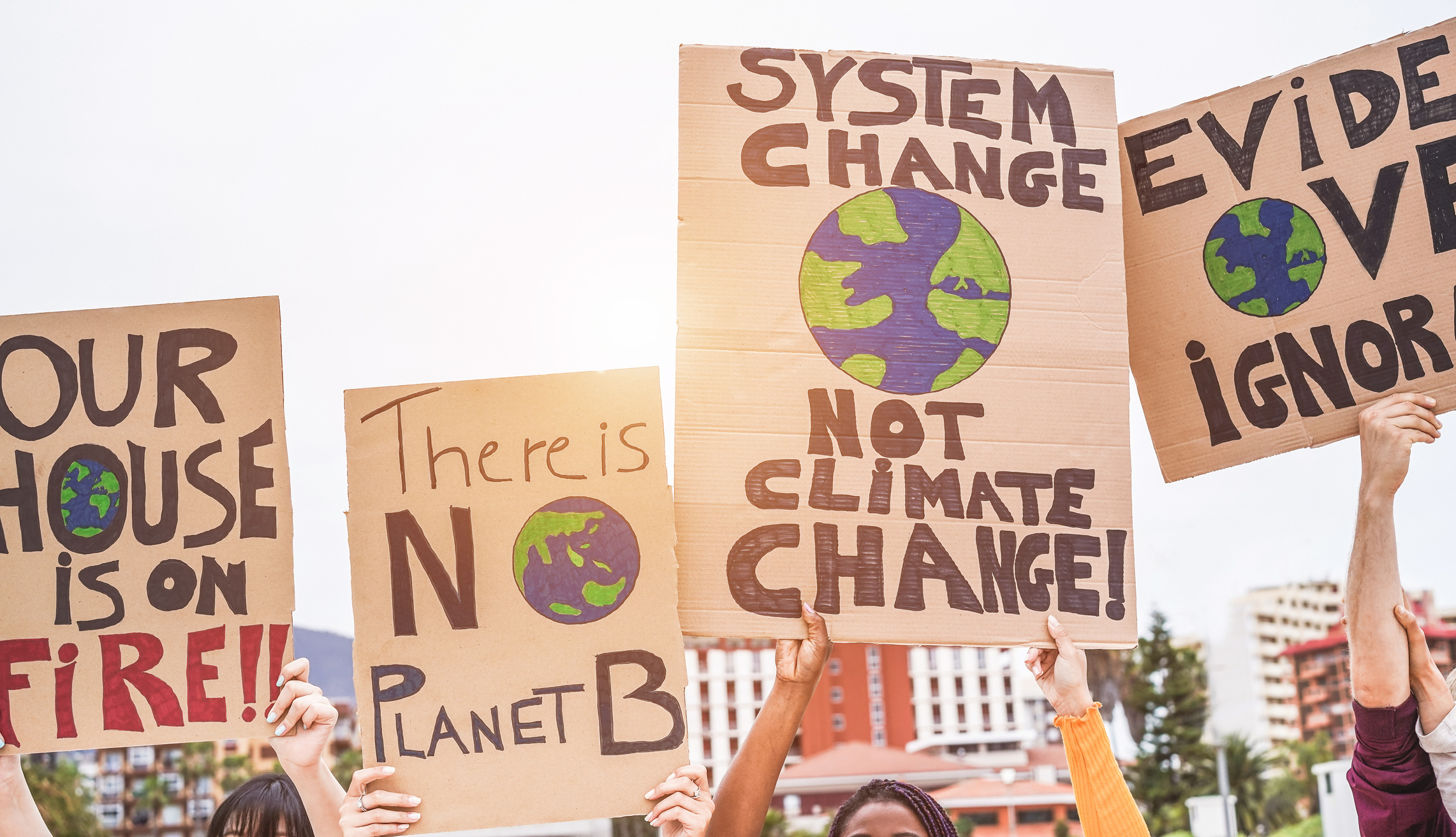 group-of-demonstrators-on-road-young-people-from-different-culture-and-race-fight-for-climate-change-global-warming-and-enviroment-concept-focus-on-banners